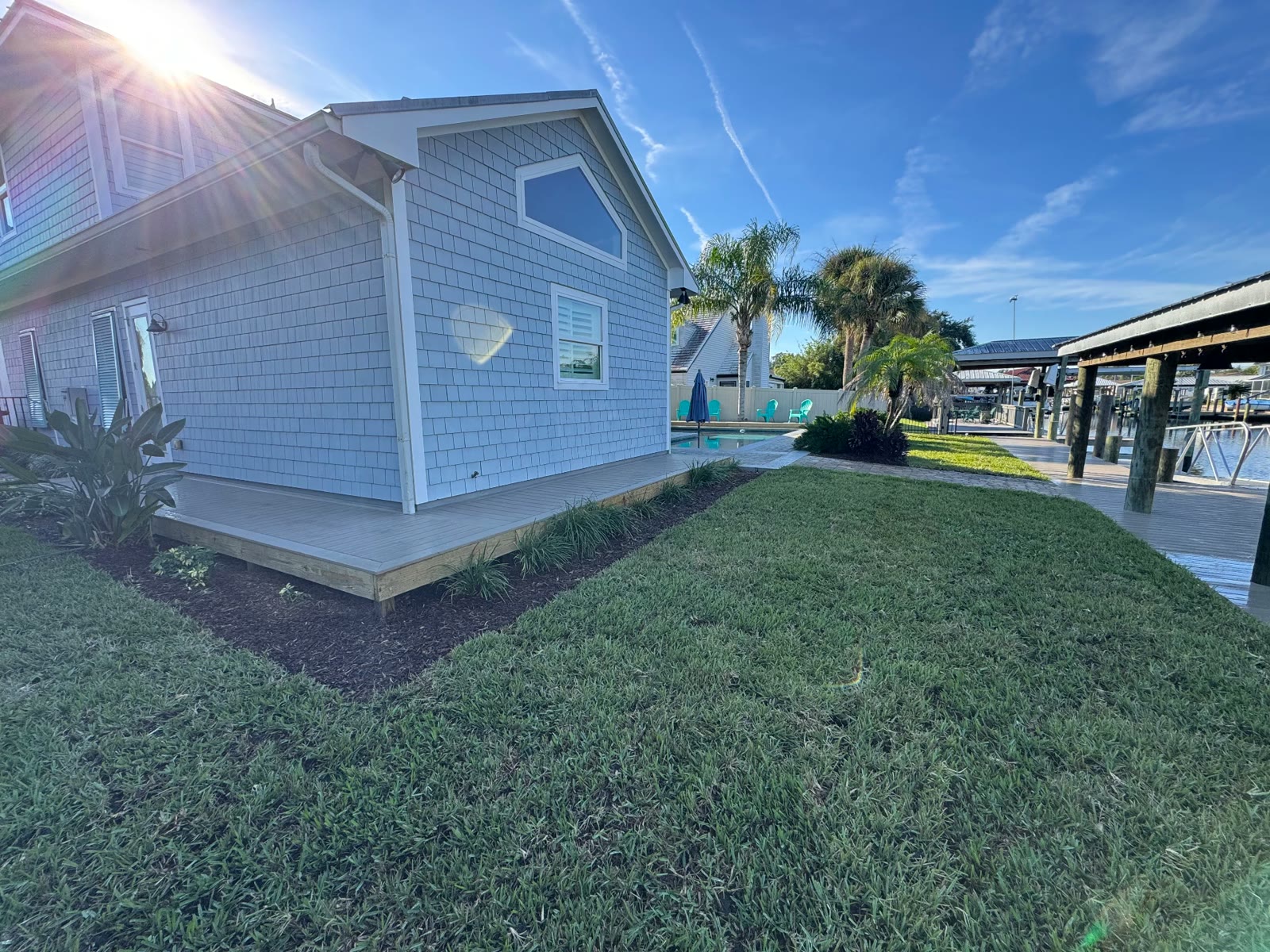 New sod and landscaping by a waterfront home