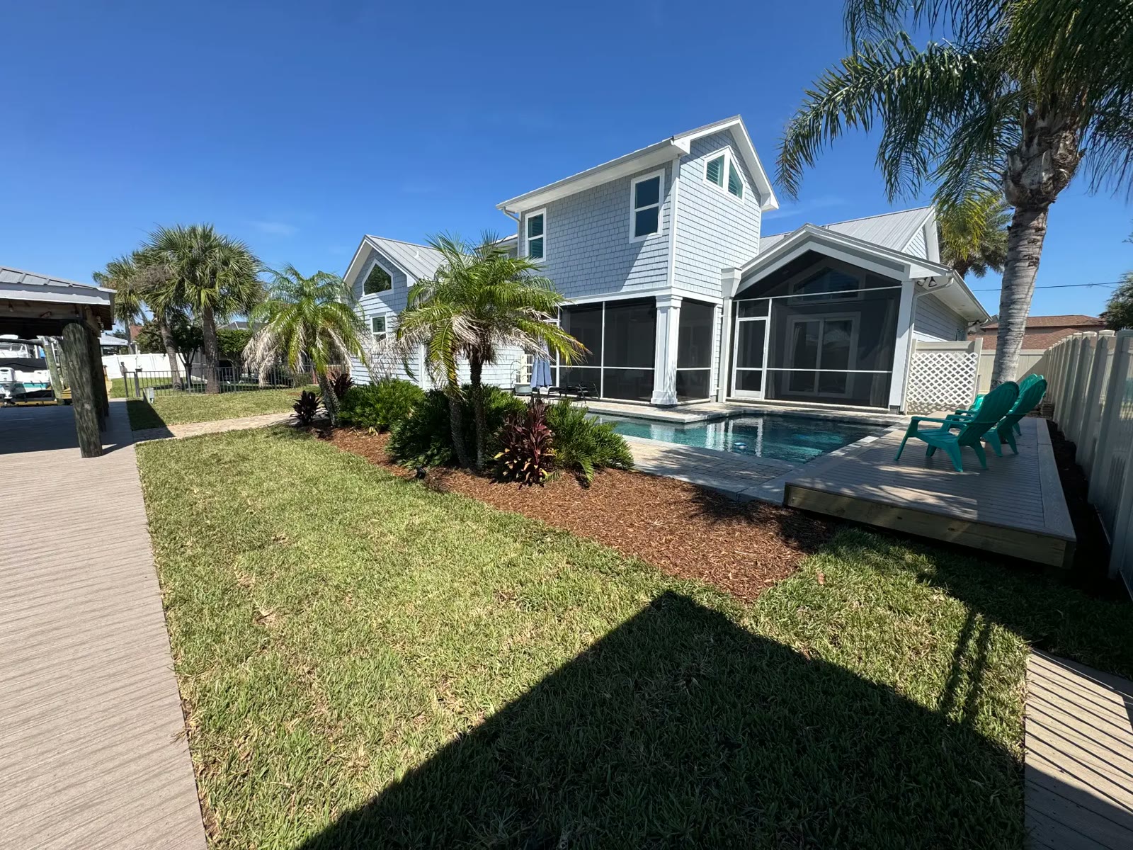 Finished backyard with pool, sod, and dock path